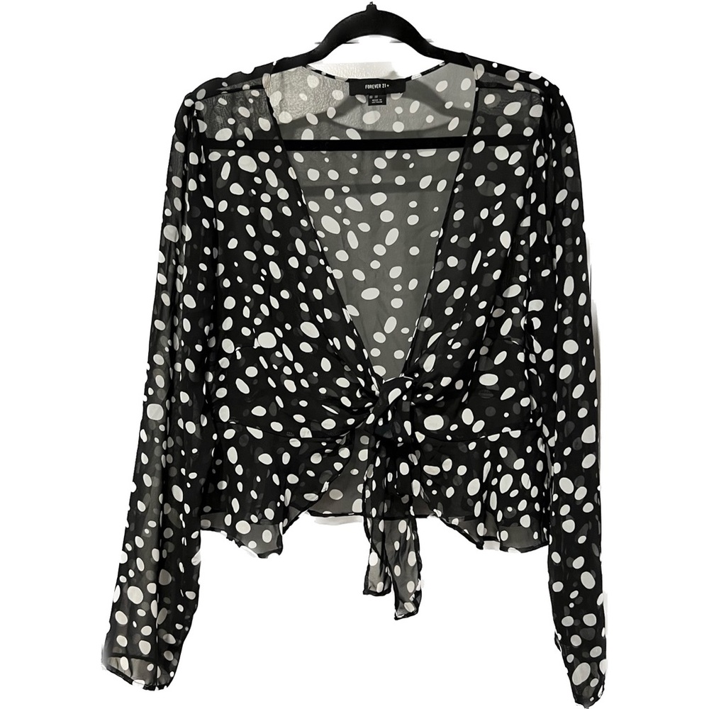 Cropped sheer polka dot peplum top with tie front